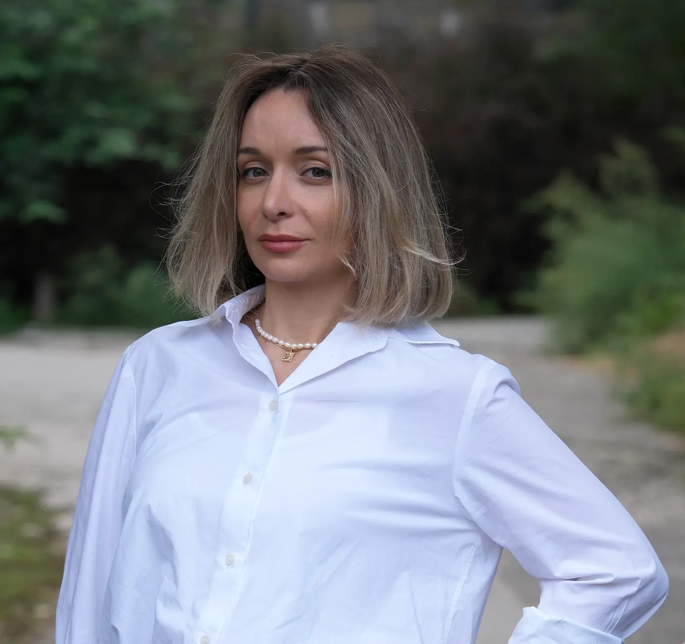 Iren Otrashevska in a white shirt outdoors